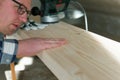 Carpentry. Wood sanding. Orbital sander for woodworking Royalty Free Stock Photo