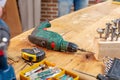 Carpentry workshop drill and other tools lie on the table Royalty Free Stock Photo