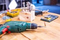 Carpentry workshop drill and other tools lie on the table Royalty Free Stock Photo