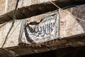 A carpet with embroidered suras from the Koran hangs on the outer wall in the Muslim part of the old city of Jerusalem in Israel