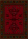 Carpet with ethnic patterned tree and birds in red and maroon shades Royalty Free Stock Photo