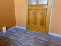 Carpet with plastic baseboard with a wooden texture. Newly installed wooden grey carpet flooring and baseboards in home