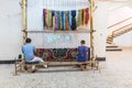Student weavers at a carpet and tapestry weaving school