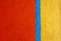 Carpet texture features created red yellow carpet background. Royalty Free Stock Photo
