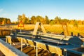 A carpet washing place in Finland at the sunset. A sign, slippery conditions in finnish language in carpet cleaning place at Royalty Free Stock Photo