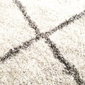 Carpeted white rug with grey stripes squares