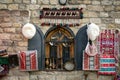 Carpets with national Azerbaijani handmade patterns, white hat made of handmade sheep wool, handbags woven of silk threads, women`