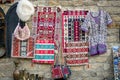 Carpets with national Azerbaijani handmade patterns, white hat made of handmade sheep wool, handbags woven of silk threads, women`