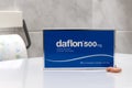 Box of Daflon coated tablets, a medicine used to treat hemorrhoids and symptoms attributable to venous insufficiency, states of