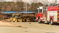 Carrboro NC, /US-March 10 2017:Fire truck with overturned logging truck