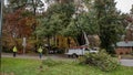Carrboro, North Carolina, US-November 13, 2018: Workers repairing power lines after tree fell on them in storm Royalty Free Stock Photo