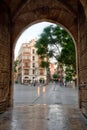 Carrer dels Serrans viewed through gate of torres de Serranos in Valencia, Spain