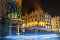 Carriage light trails before the Mariacki Church on The Main Market Square in Krakow, night vie Royalty Free Stock Photo