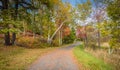 Carriage roads are surrounded by bright fall foliage on a partly cloudy afternoon at Minnewaska State Park, Kerhonksen, NY Royalty Free Stock Photo