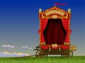A carriage scene of a roving theater on wheels with a red curtain and decorationsin the field against the sky Royalty Free Stock Photo