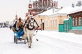 Carriage with tourists in the heart of the ancient russian town