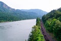 Carriages train railway along scenic wild Gorge Columbia River Royalty Free Stock Photo