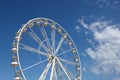 White ferris wheel against a blue sky background Royalty Free Stock Photo