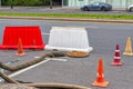 Carriageway roads with an open sewer manhole with pipes of the pump Royalty Free Stock Photo