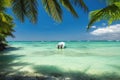 Beautiful caribbean sea and boat on the shore of exotic tropical island beach Royalty Free Stock Photo