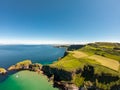 Carrick a Rede Rope Bridge in Ballintoy Northern Ireland. Aerial view on Cliffs and turquoise Atlantic Ocean water Royalty Free Stock Photo