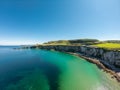 Carrick a Rede Rope Bridge in Ballintoy Northern Ireland. Aerial view on Cliffs and turquoise Atlantic Ocean water Royalty Free Stock Photo