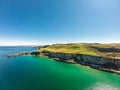 Carrick a Rede Rope Bridge in Ballintoy Northern Ireland. Aerial view on Cliffs and turquoise Atlantic Ocean water Royalty Free Stock Photo