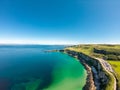 Carrick a Rede Rope Bridge in Ballintoy Northern Ireland. Aerial view on Cliffs and turquoise Atlantic Ocean water Royalty Free Stock Photo