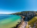 Carrick a Rede Rope Bridge in Ballintoy Northern Ireland. Aerial view on Cliffs and turquoise Atlantic Ocean water Royalty Free Stock Photo