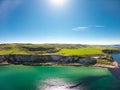 Carrick a Rede Rope Bridge in Ballintoy Northern Ireland. Aerial view on Cliffs and turquoise Atlantic Ocean water Royalty Free Stock Photo