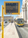 Carris bus in Lisbon approaching the stop with information panel on waiting times. Royalty Free Stock Photo