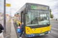 Carris public passenger bus number 735 heading to Cais de SodrÃ© stopped to pick up users Royalty Free Stock Photo