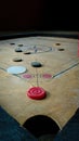 Carrom board close up shot and white striker