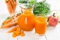 Carrot-apple juice and fresh carrots and apples