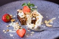 Carrot biscuit pie with cream. Cake with strawberries and lime on a beautiful plate. Photo close up. Dessert in a restaurant