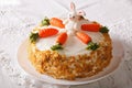 Carrot cake with candy bunny close-up on the table. horizontal Royalty Free Stock Photo