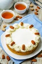 Carrot cake cheesecake with pecan on a wood background Royalty Free Stock Photo