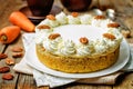 Carrot cake cheesecake with pecan on a wood background Royalty Free Stock Photo