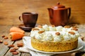 Carrot cake cheesecake with pecan on a wood background Royalty Free Stock Photo