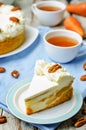Carrot cake cheesecake with pecan on a wood background Royalty Free Stock Photo