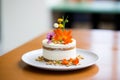 carrot cake with cream cheese frosting, nuts garnish on display Royalty Free Stock Photo