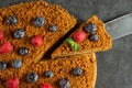 carrot cake decorated with blueberries and raspberries on a dark background Royalty Free Stock Photo