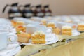 Carrot cake with fruit tart and empty cups Royalty Free Stock Photo