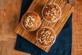 Carrot cake muffins with nuts, raisins and oats on a wooden back Royalty Free Stock Photo