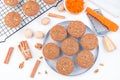 Carrot cake muffins with walnuts on gray plate and cooling rack, horizontal, top view Royalty Free Stock Photo