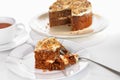 Carrot cake slice served on a plate with fork on a white surface Royalty Free Stock Photo