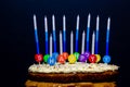 Carrot cake upper close up view, with cream chesse frosting and coconut shavings , happy birthday candle bases witn Royalty Free Stock Photo