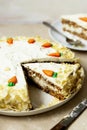 Carrot cake with walnuts an whipped cream, homemade easter cake baking, top view. Whole round cake Royalty Free Stock Photo