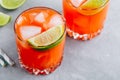 Carrot Ginger Margarita cocktail with lime in glass