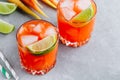 Carrot Ginger Margarita cocktail with lime in glass